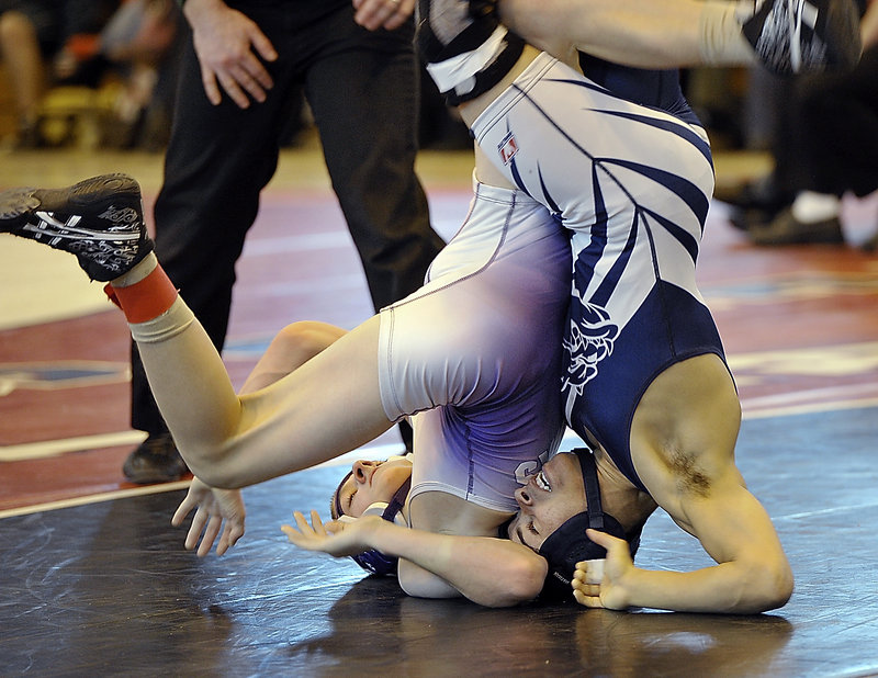 Portland’s Kidayer Aljubyly, right, performs a rolling maneuver during his semifinal match with Marshwood’s Darren LaPointe. Aljubyly went on to capture the 106-pound title in the Class A state championships at Sanford High.