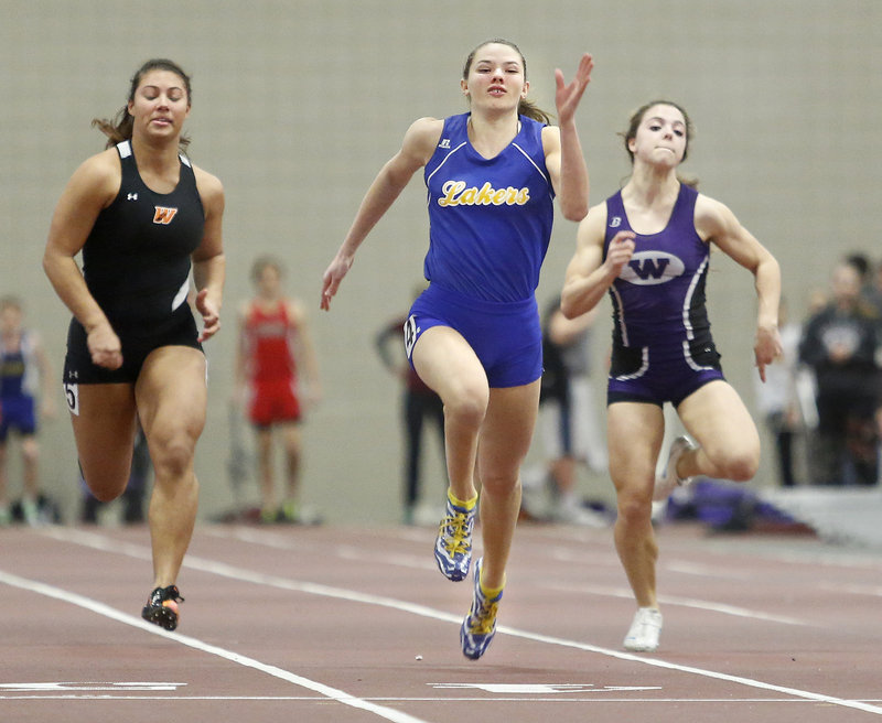 Kate Hall of Lake Region stays ahead of Georgia Bolduc of Waterville to win the 55-meter dash at the Class B state meet Monday at Bates College in Lewiston. Hall also won the 200 and long jump, setting Class B records in both events.