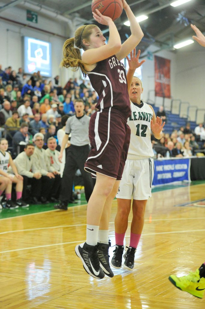 Jaclyn Storey, who scored 10 points for Greely, looks to shoot while defended by Meagan Dow of Leavitt in a Western Class B quarterfinal at the Portland Expo. Greely won, 42-27.