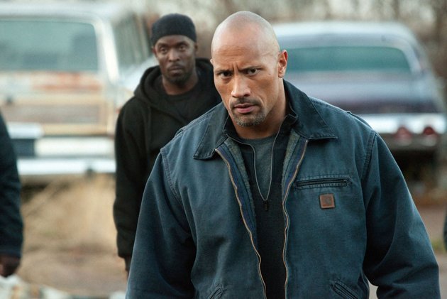 Dwayne Johnson is a father who goes undercover for the DEA to free his son, who was imprisoned after being set up in a drug deal, in “Snitch.”