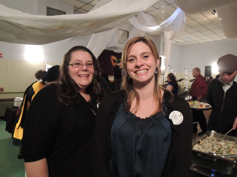 Community Partners co-workers Shiloh Legere of Lyman and Amy Duross of Saco, volunteering at the ball.