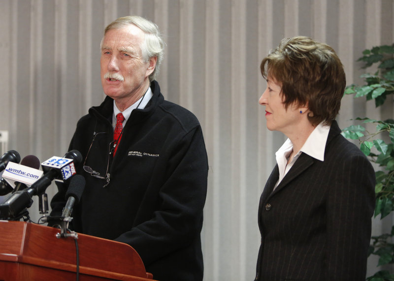 Sen. Angus King speaks at a news conference at Bath Iron Works on Thursday. At right is Sen. Susan Collins.