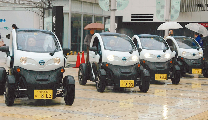 Nissan and the Japanese government are conducting a two-week trial of the ultra-minicars, with suburban families seen as a likely market down the road.