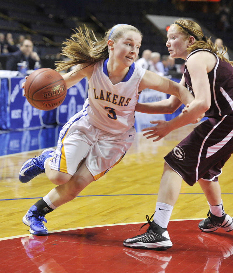 CeCe Hancock of Lake Region keeps Haley Felkel of Greely away while heading to the basket on a drive in their Western Class B semifinal.