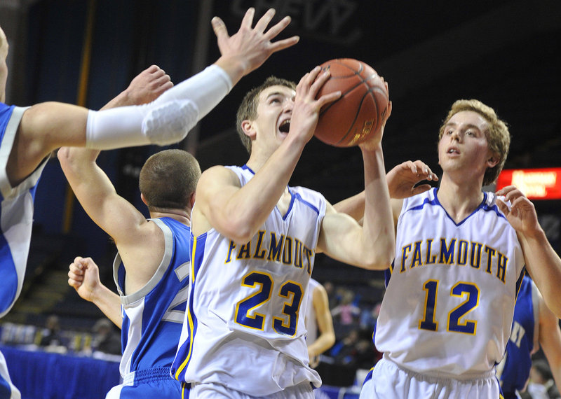Charlie Fay of Falmouth pulls down a rebound next to teammate Tom Wilberg during a 58-22 win over Mountain Valley.