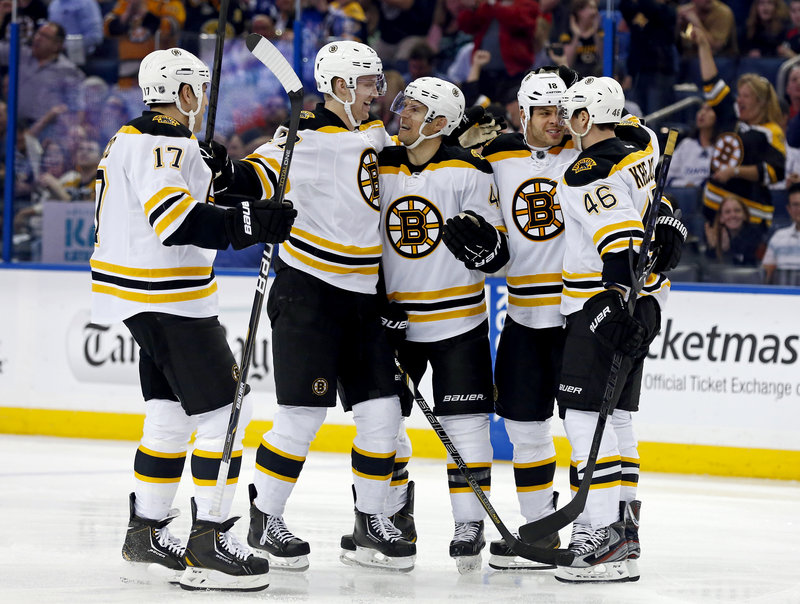 The Bruins, from left, Milan Lucic, Dougie Hamilton, Dennis Seidenberg, Nathan Horton and David Krejci celebrate a first-period goal during Thursday’s win at Tampa.