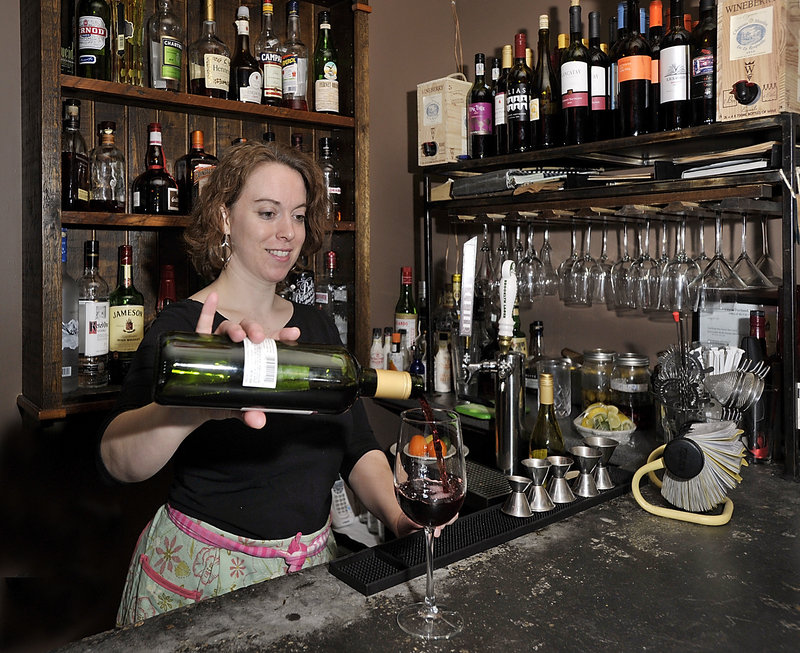 Bartender Jenny Williamson pours a glass of Alias Cabernet during “Wine Time,” from 4:30 to 6 p.m., when wine specials are featured at Blue Spoon in Portland.