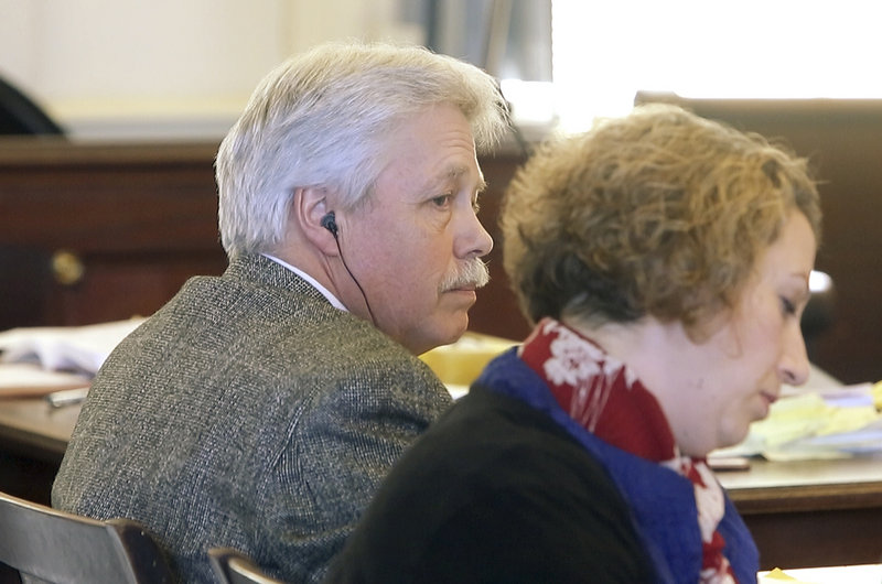 Defendant Mark Strong Sr. listens to questions asked during a motion hearing at York County Superior Court in Alfred on Friday, February 22, 2013. At right is his co-counsel Tina Nadeau.