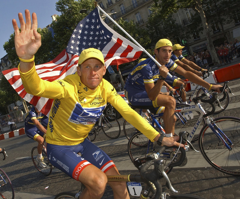 U.S. Postal Service cycling team leader and Tour de France winner Lance Armstrong rides the victory lap on the Champs-Elysees boulevard in Paris in 2004.
