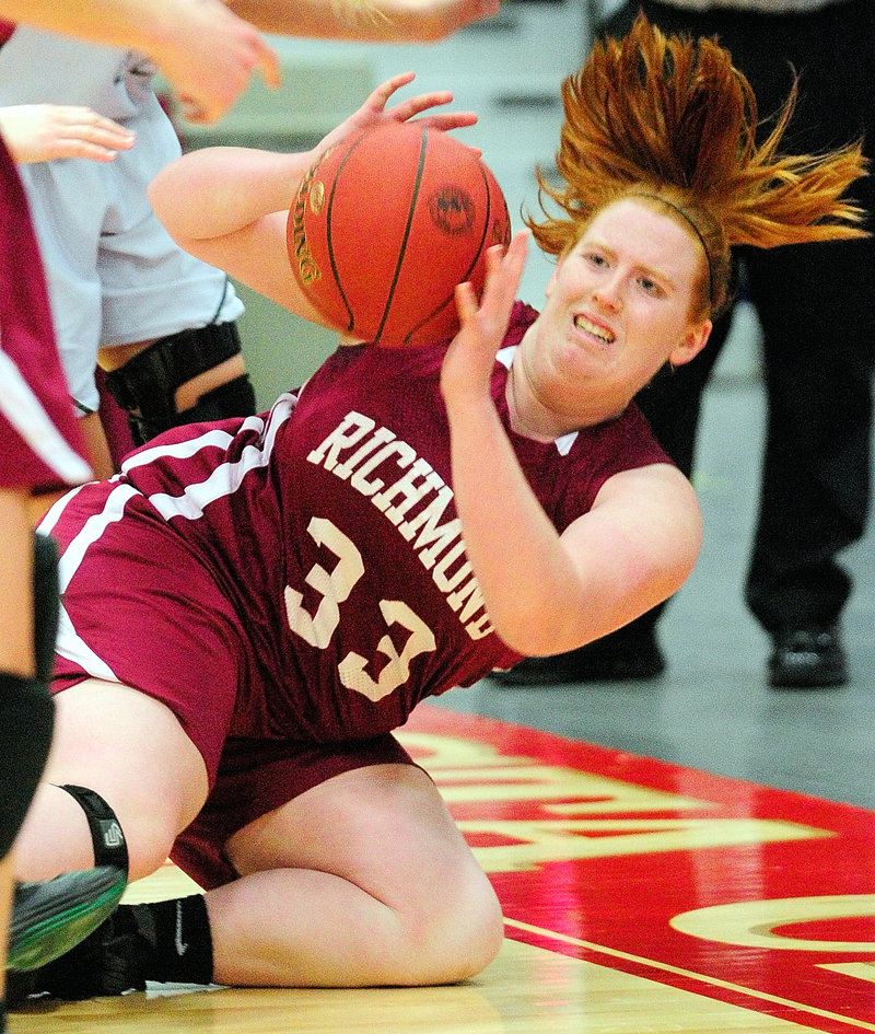 Alyssa Peterson of Richmond goes to the ground to keep the ball in play during the Western Class D win over Rangeley.