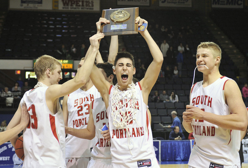 What more could they want? A Gold Ball? That chance is next, but for now, Calvin Carr, center, Tanner Hyland, left, and Ben Burkey of South Portland love the spoils.