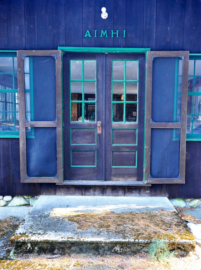 A colorful door leads into the main lodge’s playroom at Aimhi Lodge, once a popular family lodge on Little Sebago Lake.