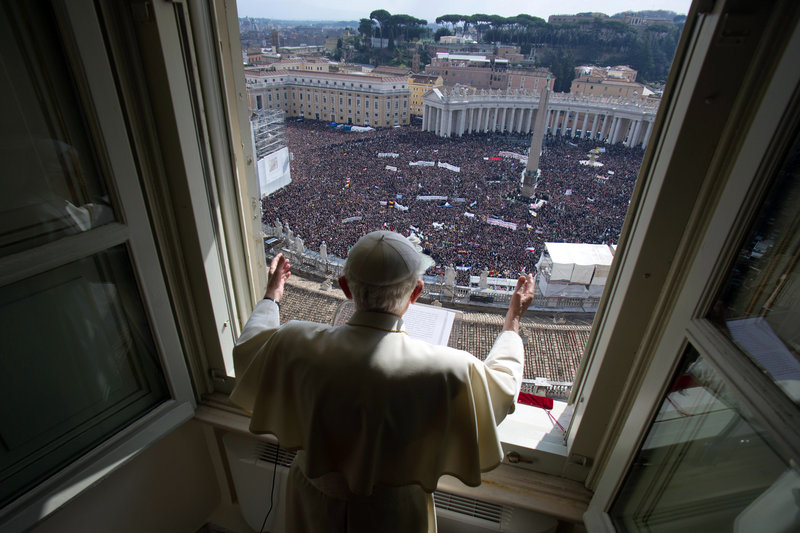 Pope Benedict XVI delivers his blessing during his last Angelus noon prayer, from the window of his apartment overlooking St. Peter’s Square at the Vatican on Sunday.