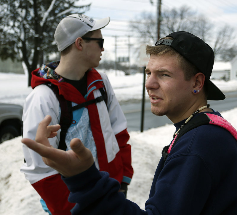 Cieran-Patrick Paterson, at right, an SMCC sophomore, looks toward a road block on Benjamin W. Pickett Street while he and his suitemate, Gavin Bourbon, a freshman, wait to re-enter their dorm after the campus was evacuated because of a bomb threat Monday morning, Feb. 25, 2013.