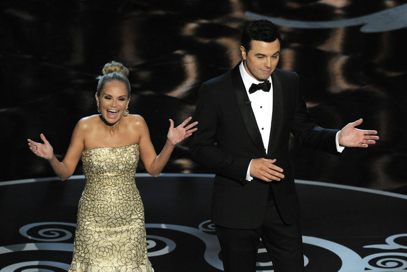 Host Seth MacFarlane and actress Kristin Chenoweth perform a song dedicated to the “losers” during the finale of the Oscars on Sunday in Los Angeles.
