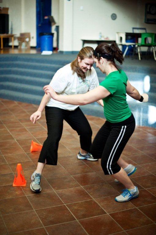 Katie Bell and Tina Burnell play “cone tag” during a Punk Rope class at Riverton Elementary School. The class begins with stretching and moves on to a series of mini-sessions that include jumping rope and schoolyard games. It’s all set to “fast and fun” music, says instructor Allison Kennie.