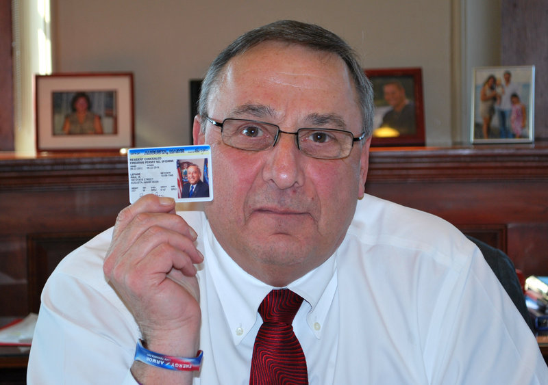 Gov. Paul LePage displays his permit to carry a concealed weapon. The Maine Legislature recently passed a temporary ban, proposed by LePage, on releasing the names of concealed-carry permit holders.