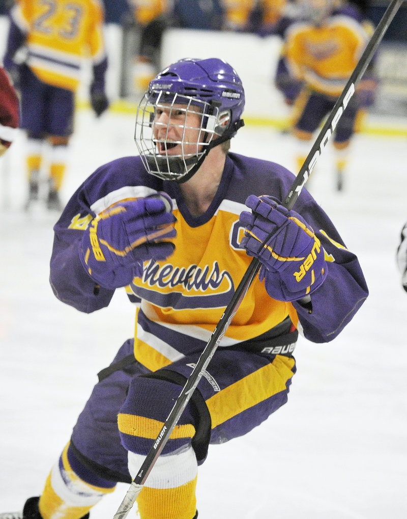 Liam Fitzpatrick, who would score the second-overtime winner, celebrates a second-period goal for Cheverus.