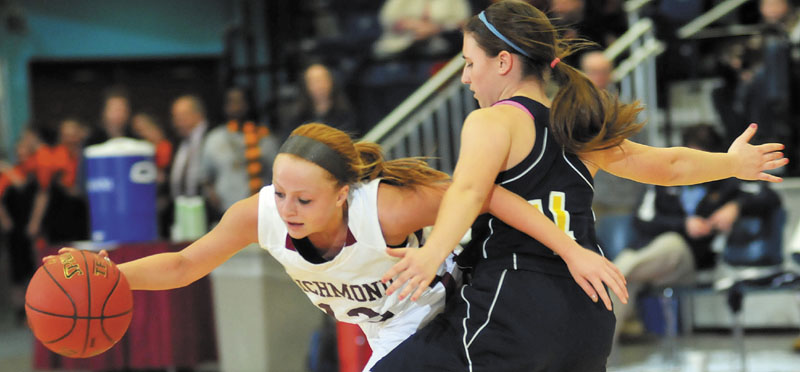 Richmond's Noell Acord, left, collides with Hyde's Shannon Ward in a Western Class D semifinal at the Augusta Civic Center. Richmond advanced to the regional final with a 43-36 victory.