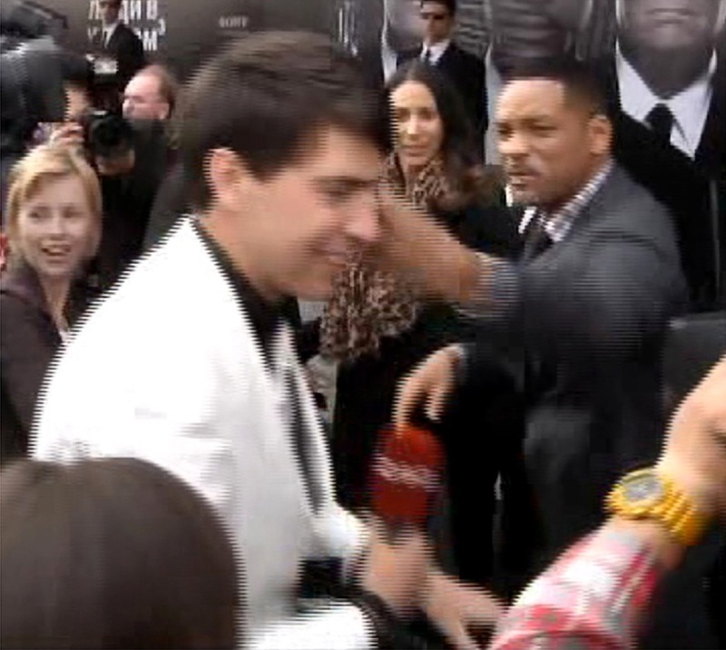 U.S. actor Will Smith, right, slaps reporter Vitalii Sediuk before the premiere of “Men in Black III” last May in Moscow.