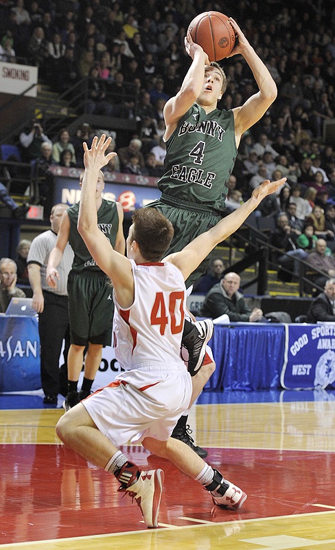 Dustin Cole, who scored 36 points Saturday night for Bonny Eagle, pulls up for a shot against Trevor Borelli of South Portland in the Western Class A final.