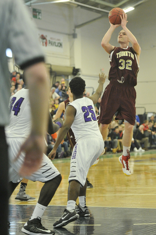 Quinn Richardson-Newton of Thornton Academy lifts a shot during the upset of Deering.