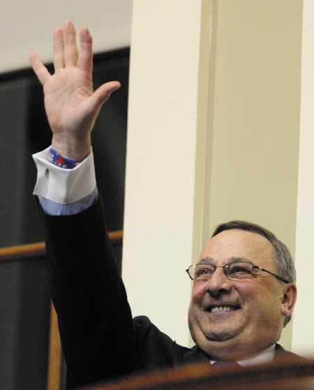 Staff photo by Joe Phelan Gov. Paul LePage waves as he mounts the rostrum to give the State of the State address on Tuesday February 5, 2013 in the State House in Augusta.