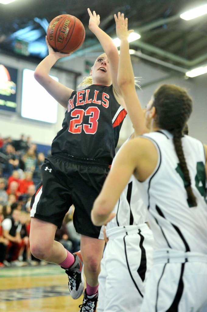 Alison Furness of Wells take a shot during a Western Class B girls' basketball quarterfinal Tuesday against Spruce Mountain. Wells, the No. 11 seed, advanced with a 43-42 win over the previously undefeated Phoenix.