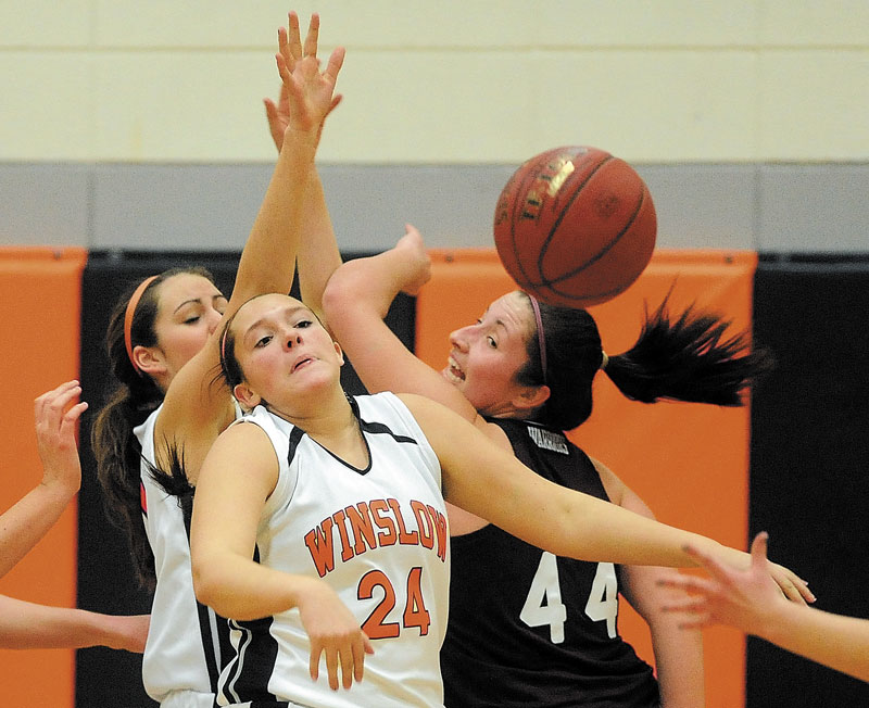 LOOSE BALL: Winslow High School’s Hannah Doble (24) and Nokomis High School’s Mikayla Charters (44) look for the rebound in a game earlier this season. The Black Raiders, the No. 13 seed, play No. 5 MDI in an Eastern B quarterfinal game Saturday. No. 3 Nokomis, meanwhile, plays No. 6 Belfast tonight.