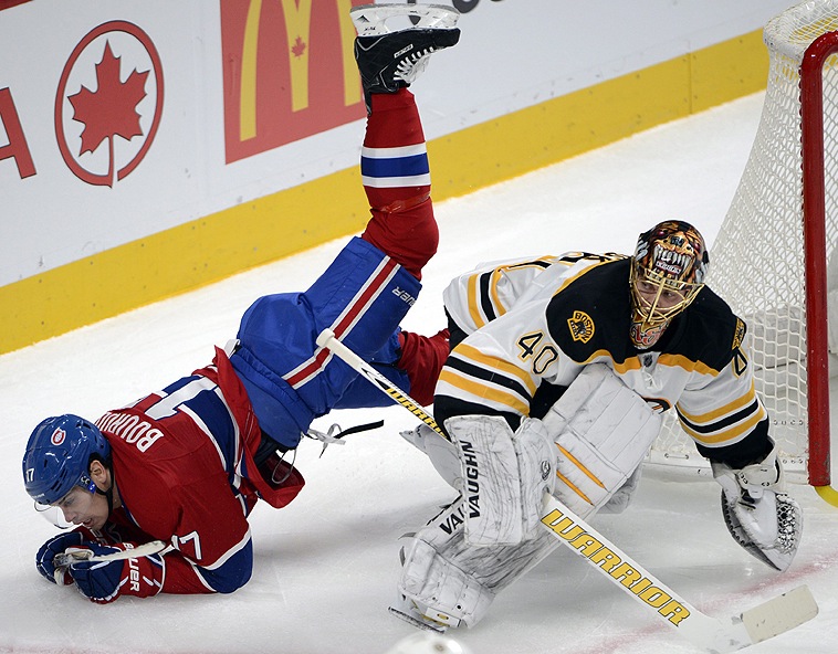 Rene Bourque of Montreal flips over Bruins goalie Tuukka Rask in Wednesday’s game at Montreal. The Bruins moved into first place with a 2-1 win. Canada Quebec Montreal hockey;NHL;athlete;athletes;athletic;at
