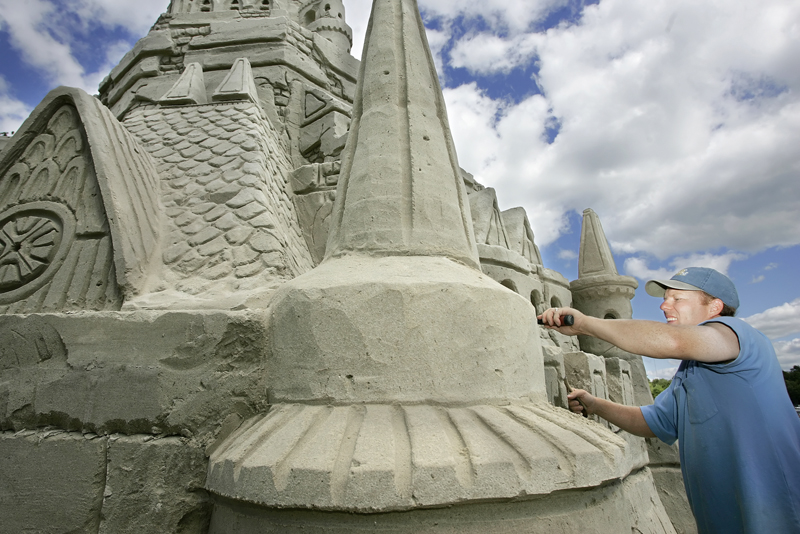 In this file photo from 2007, Ed Jarrett tries set a new Guinness World Record for the tallest sand castle at Point Sebago Resort in Casco.