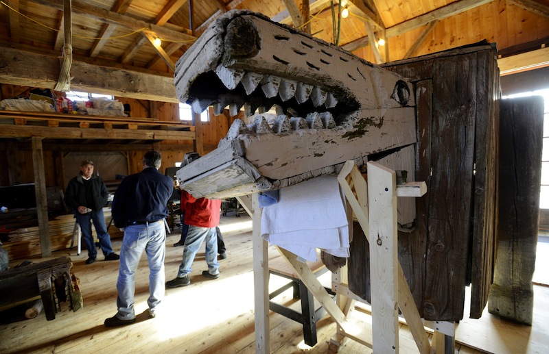 In this November 2012 file photo, a lion by Bernard Langlais is being restored at Preservation Timber Framing. The work of the late Maine artist Bernard "Blackie" Langlais will be distributed for free and the place where he made it will be preserved, in an arrangement announced Monday by the Colby College Museum of Art.