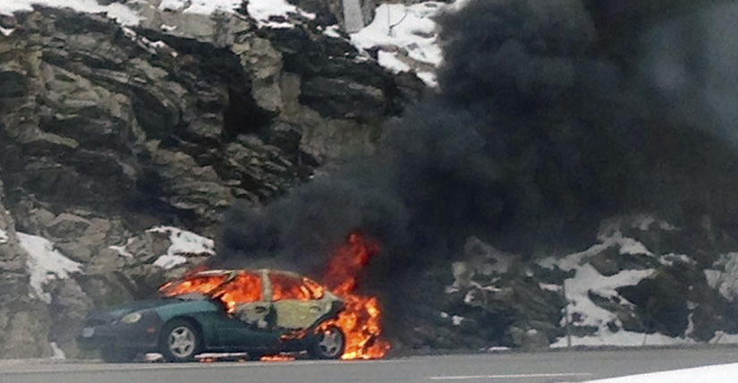 Flames envelope a car on I-295 Friday morning. Contributed photo by Sean Anderton.