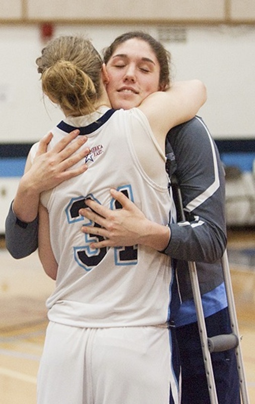 Liz Wood, another member of the UMaine team, hugs injured Danielle Walczak after the game. “We didn’t want the season to end with (the crash),” said Wood, a freshman from Catlett, Va. “I’m glad we played. I didn’t think about (the crash) for the whole game.” Walczak’s injuries are unrelated to last week’s accident.