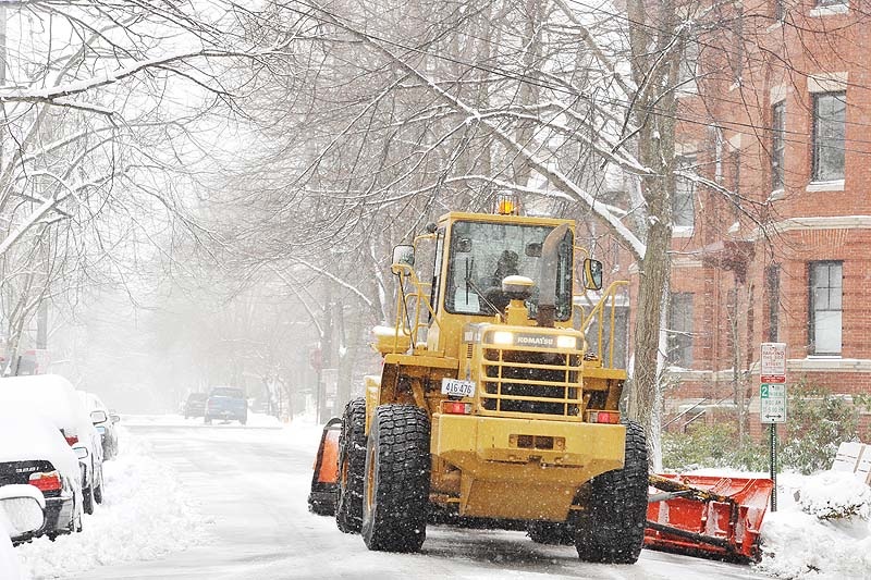 A Portland plow driver makes his way up Neal Street in the city's West End as a late-season snowstorm begins to pummel Maine on Tuesday, March 19, 2013