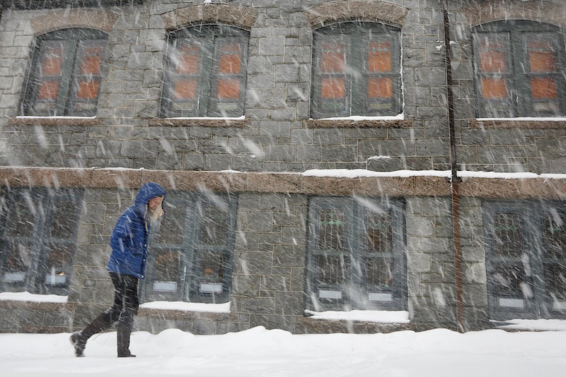Adam King of Portland walks past the St. Lawrence Arts and Community Center on Congress Street on Tuesday, March 19, 2013 during a late season snowstorm.