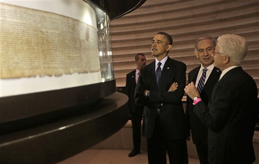 US President Barack Obama, 3rd right, views the Dead Sea Scrolls with Israeli Prime Minister Benjamin Netanyahu, 2nd right, and Director of the Museum, James Snyder, far right at the Israel Museum in Jerusalem, Israel, Thursday, March 21, 2013. After a visit to Israel's national museum to inspect the Dead Sea Scrolls, which highlight the Jewish people's ancient connection to the land that is now Israel, Obama headed to the West Bank to tell the Palestinians that the creation of a Palestinian state remains a priority for his administration. (AP Photo/Pablo Martinez Monsivais)