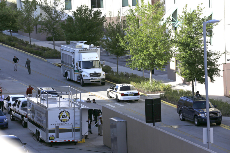 Investigators from various law enforcement agencies converge on the University of Central Florida in Orlando on Monday. Explosive devices were found after the apparent suicide of a former student who authorities said had planned an attack and “laid out a timeline.”