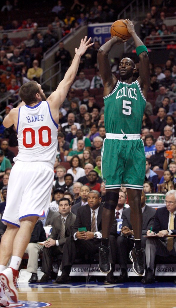 Boston Celtics' Kevin Garnett (5) shoots over Philadelphia 76ers' Spencer Hawes (00) in the first half of an NBA basketball game, Tuesday, March 5, 2013, in Philadelphia. (AP Photo/H. Rumph Jr)
