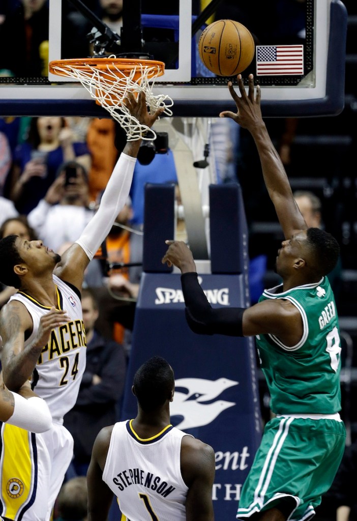 Boston Celtics' Jeff Green, right, shoots the game-winning basket against Indiana Pacers' Paul George (24) and Lance Stephenson (1) Wednesday in Indianapolis. Boston defeated Indiana 83-81.