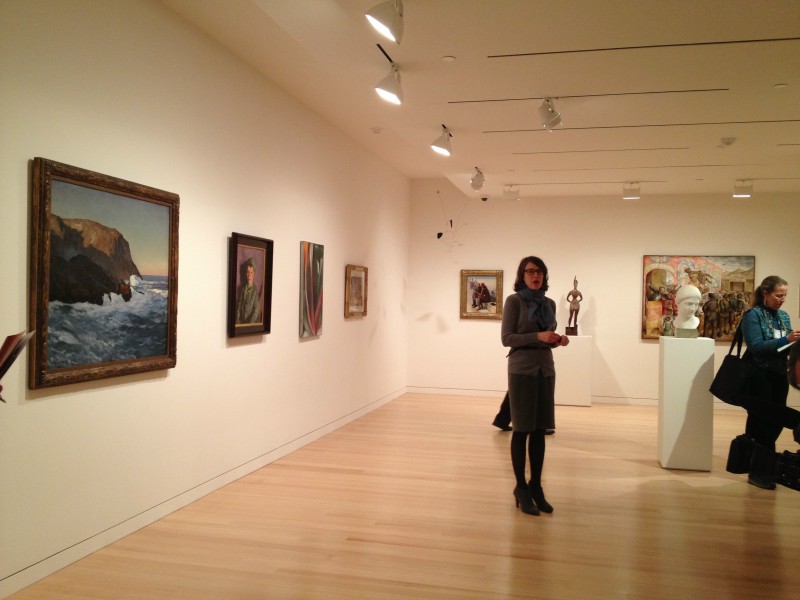 Colby College Museum of Art director Sharon Corwin describes the layout of a gallery on Monday, March 25, 2013. In foreground is a painting by Rockwell Kent.