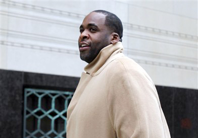 Former Detroit Mayor Kwame Kilpatrick makes his way to federal court in Detroit on Monday.