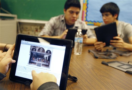 Ysabella Ortegon, 16, reads about Leonardo da Vinci's painting "The Last Supper" while working on her iPad at McAllen Memorial High School in McAllen, Texas, recently.