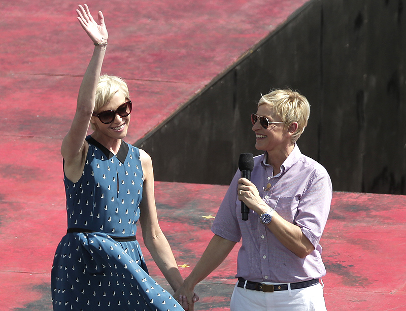 Talk show host Ellen DeGeneres, right, introduces her wife, Portia de Rossi, Saturday in Sydney, Australia.