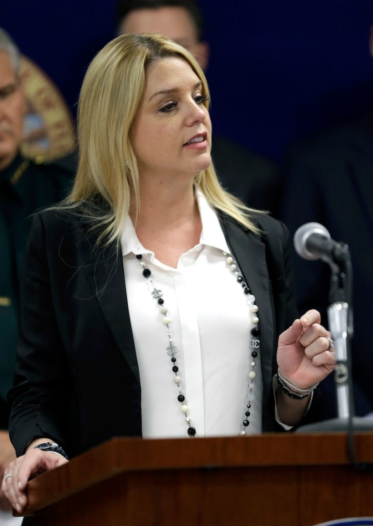 Florida Attorney General Pam Bondi speaks during a news conference Wednesday, March 13, 2013, in Orlando, Fla. Florida's lieutenant governor resigned and nearly 60 other people were charged in a widening scandal of a purported veterans charity that authorities said Wednesday was $300 million front for illegal gambling. (AP Photo/John Raoux)