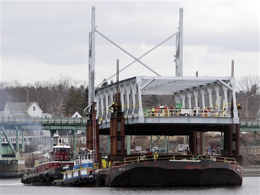 Earlier this month, work crews floated the north span of the new Memorial Bridge into place on a barge.