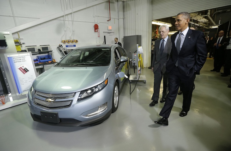 President Barack Obama and Joint Center for Energy Storage Research Director Dr. George Crabtree walk past a hybrid Chevy Volt vehicle used for testing during the president's tour of the Argonne National Laboratory in Argonne, Ill., Friday, March 15, 2013. Argonne is the first US science and engineering research national laboratory, and it remains on of the nation’s largest. (AP Photo/Pablo Martinez Monsivais)