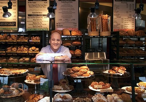 Panera Bread Co. CEO Ron Shaich stands behind a counter in a St. Louis cafe. In its latest charitable venture Panera's 48 St. Louis-area cafes will offer a bowl of turkey chili for which customers will set their own price.