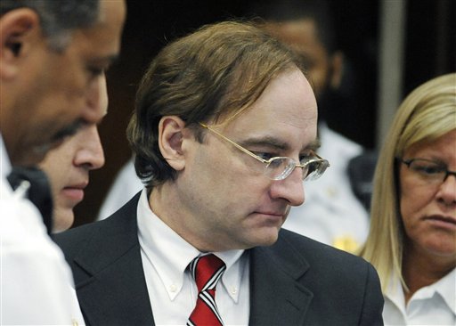 Christian Karl Gerhartsreiter, who called himself Clark Rockefeller, enters court for his kidnapping trial in Boston in this June 1, 2009, photo. He says he is not guilty of the cold case killing of John Sohus.