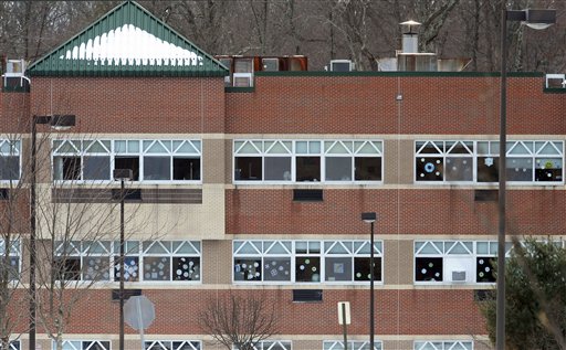 Snowflake artwork adorns windows at the new Sandy Hook Elementary School. Three months after the Newtown massacre, children and teachers who survived remain on edge.
